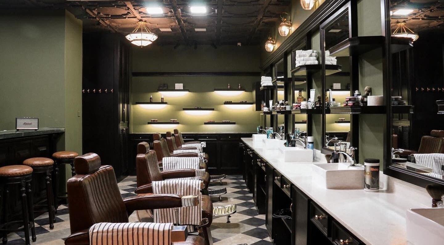 Chic interior of Burman Bogalay Zay St salon, Yangon, featuring stylish barber chairs and modern decor.