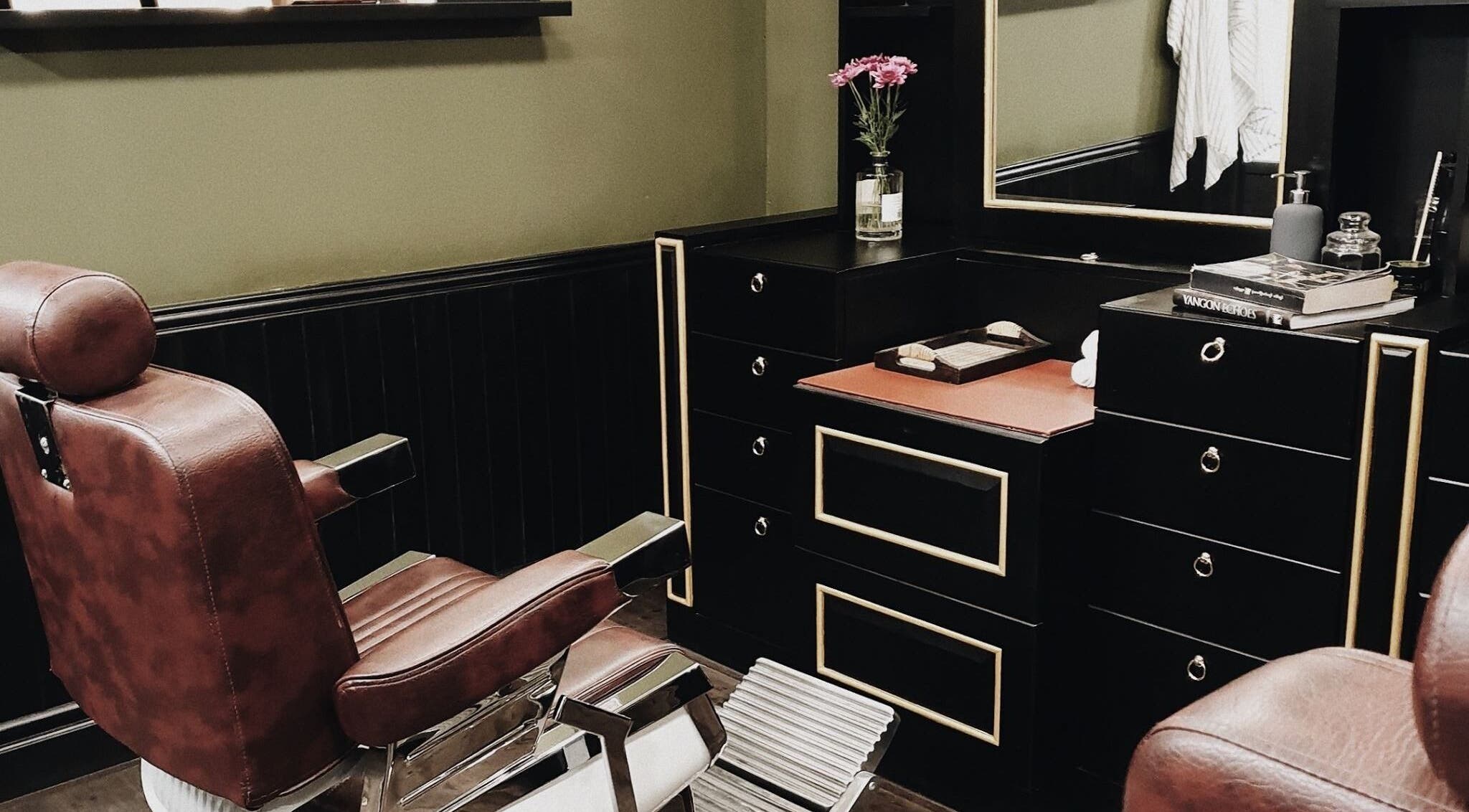 Classic barber chair and sleek vanity at Burman Bogalay Zay St, Yangon, Yangon Region, MM.