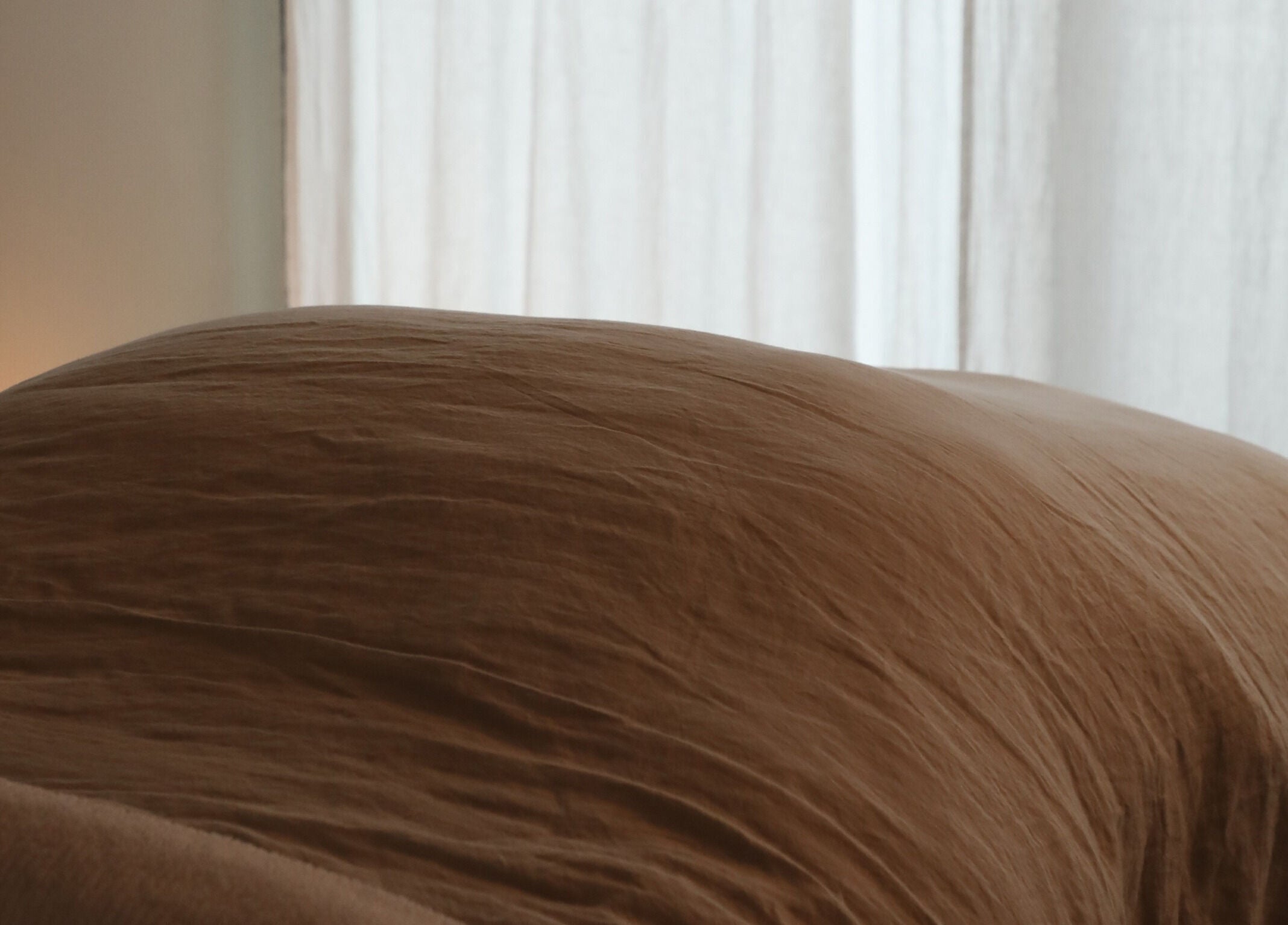 A serene massage table draped in soft linen at Soften MELBOURNE, Prahran, Victoria, AU.