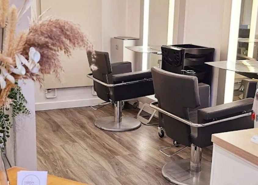 Cozy salon chairs at Tress & Bloom Ystradgynlais, Ystradgynlais, Wales, GB, offering a welcoming beauty space.