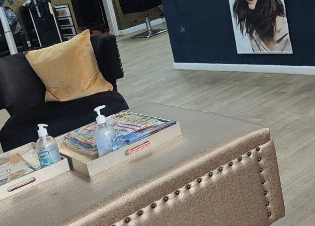 Relaxing seating area at Tress & Bloom Ystradgynlais, showcasing chic decor in Ystradgynlais, Wales, GB.