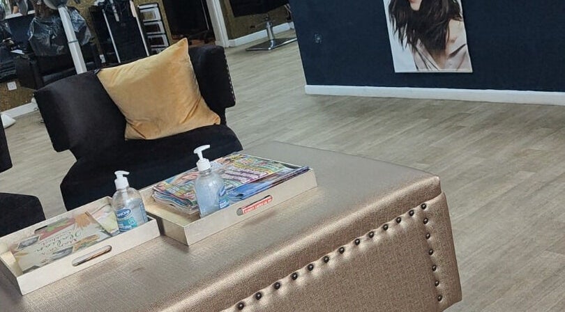 Relaxing seating area at Tress & Bloom Ystradgynlais, showcasing chic decor in Ystradgynlais, Wales, GB.