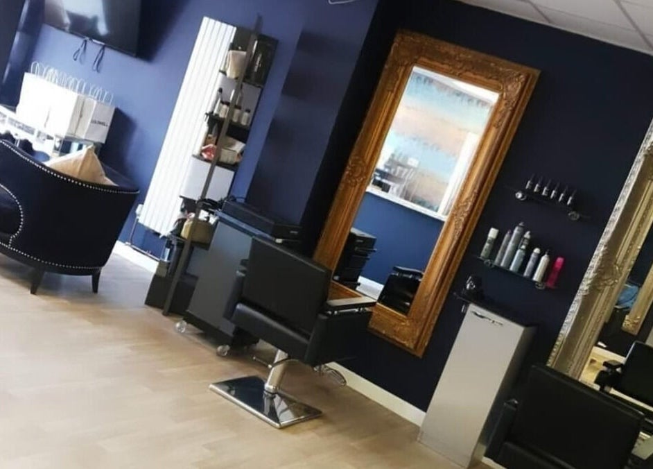 Interior of Tress& Bloom Ystradgynlais salon in Ystradgynlais, Wales, GB with upscale seating and mirrors.
