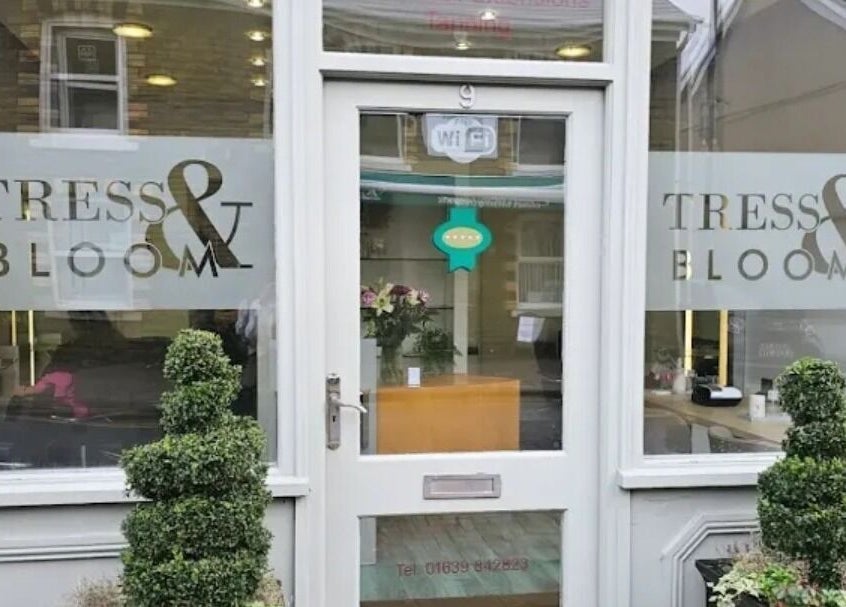 Front of Tress& Bloom Ystradgynlais with signage in Ystradgynlais, Wales, GB, featuring greenery.