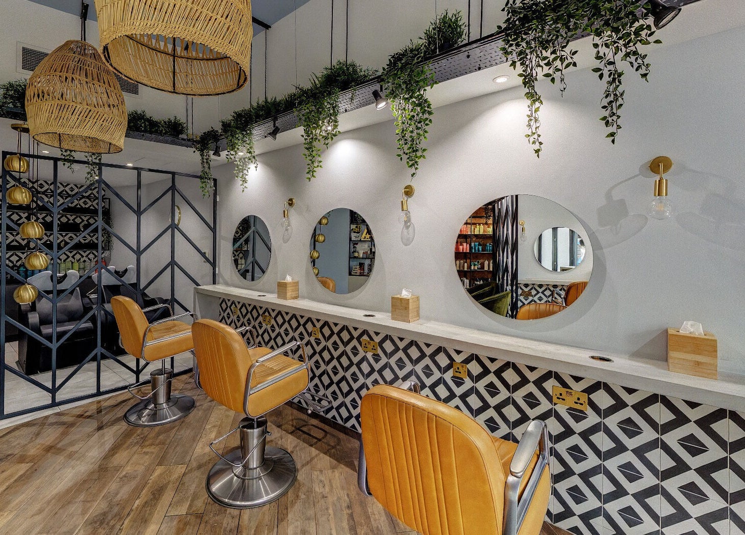 Modern salon interior at Tribe Academy - Clapham Common, featuring chic decor and styling chairs, London, England, GB.