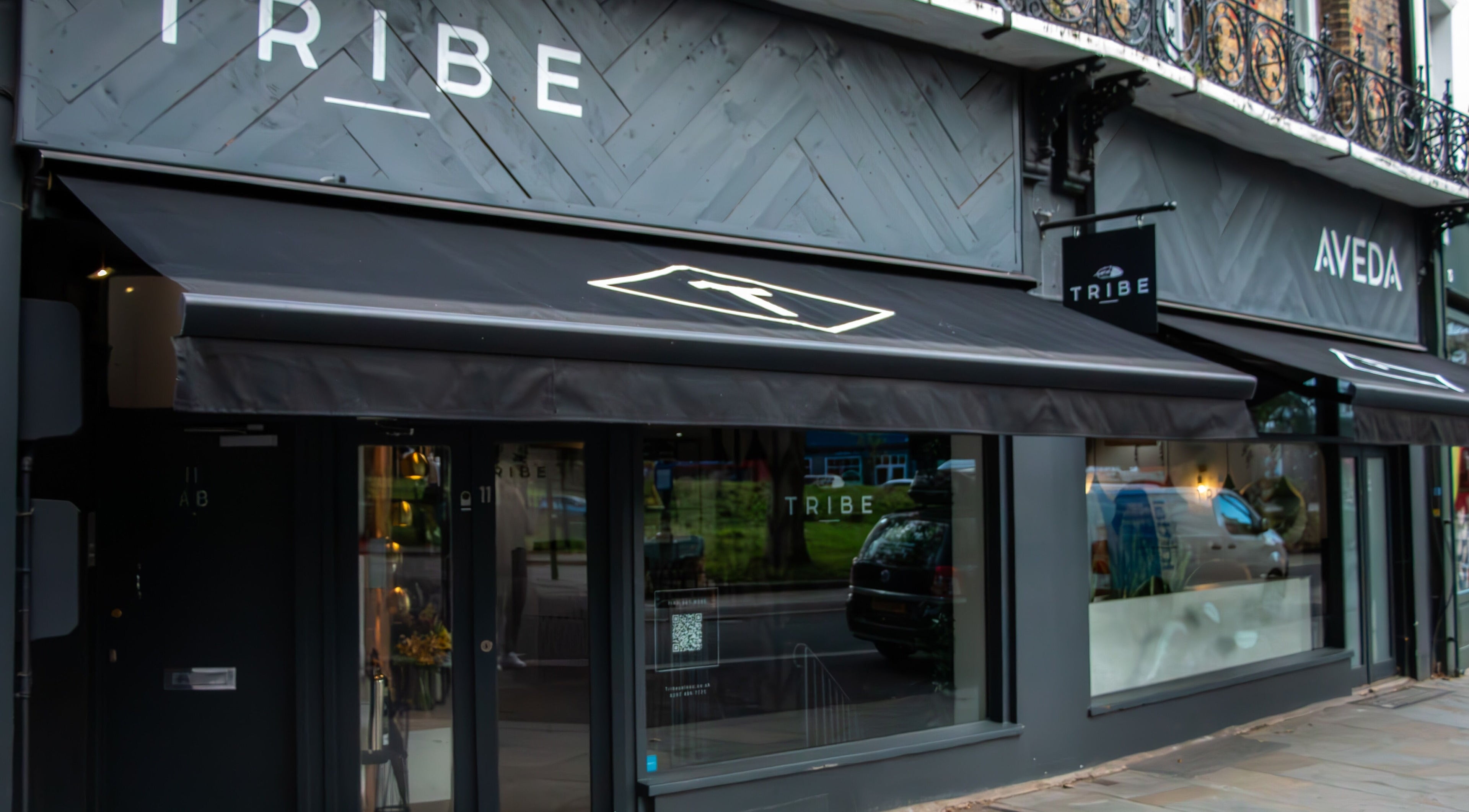 Tribe Academy - Clapham Common exterior in London, England, GB with stylish black awnings.