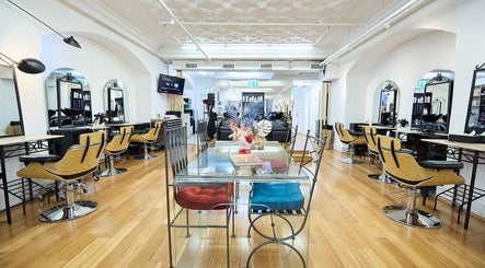 Modern salon layout at StyleLab Hair, Sydney, New South Wales, AU with stylish chairs and elegant decor.