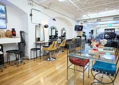 Modern interior of StyleLab Hair in Sydney, New South Wales, AU showcasing stylish chairs and decor.