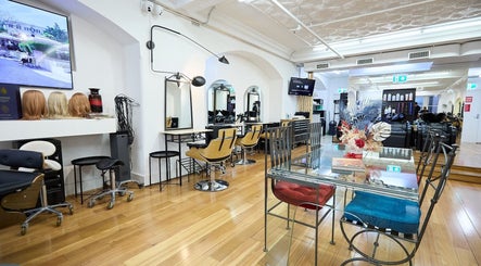 Modern interior of StyleLab Hair in Sydney, New South Wales, AU showcasing stylish chairs and decor.