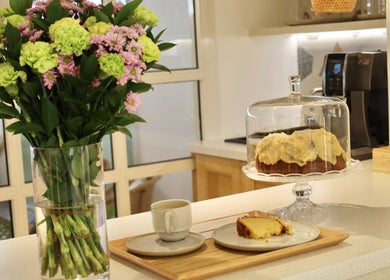 Elegant floral arrangement and cake at Essential Beauty Salon, Dubai, Dubai, AE creates a serene ambiance.
