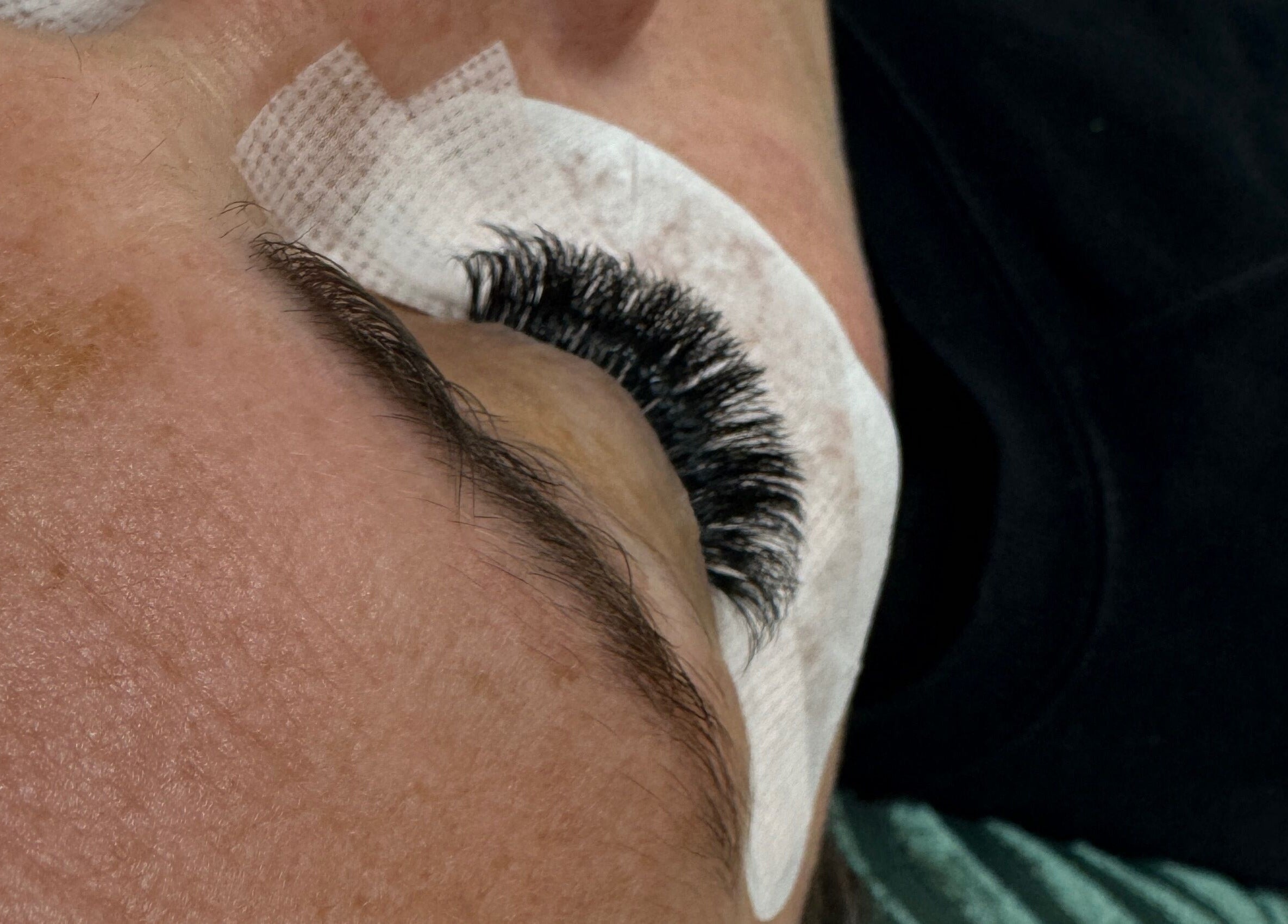 Close-up of eyelash extension at Made Up Salon, Rochester, England, GB.