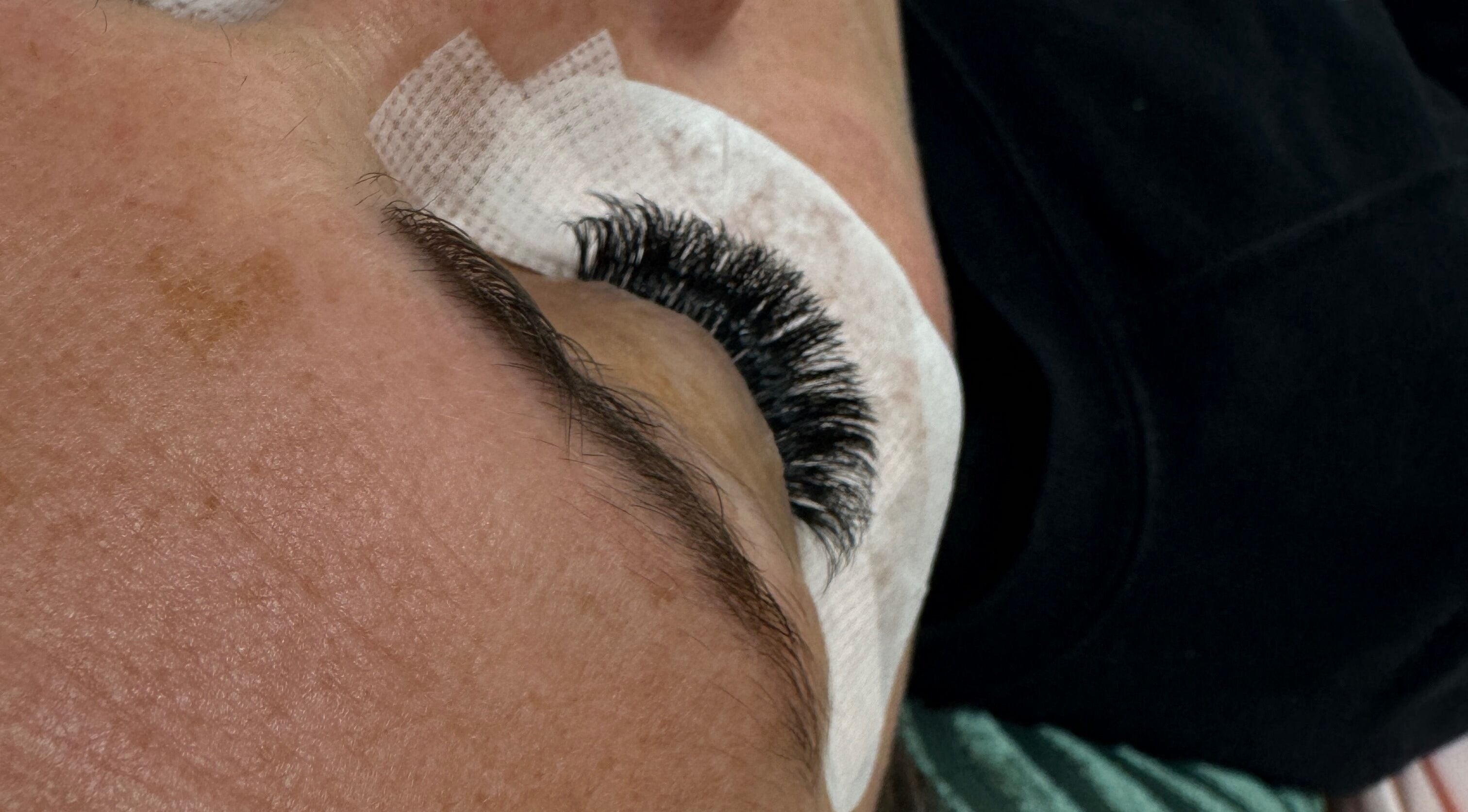 Close-up of eyelash extension at Made Up Salon, Rochester, England, GB.