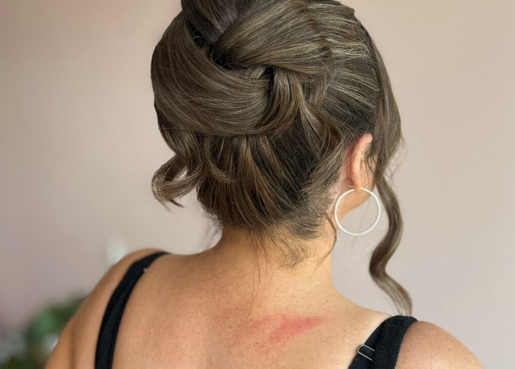 Chic updo hairstyle at Made Up Salon, Rochester, England, GB, highlighting professional styling.