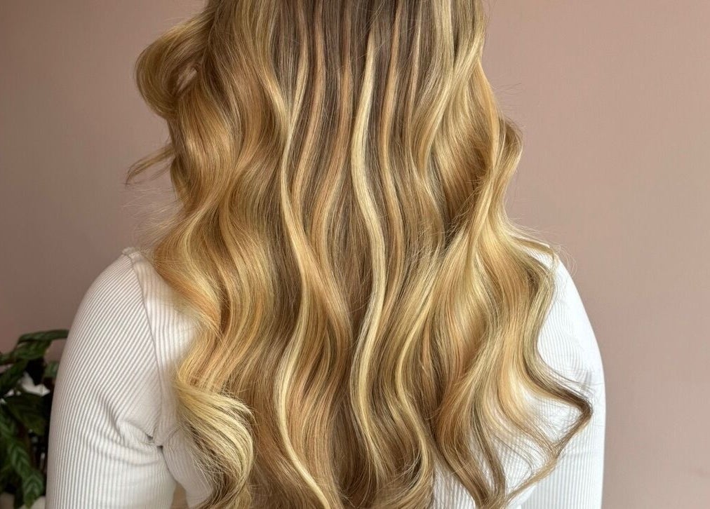 Silky blonde waves styled at Made Up Salon, Rochester, England, GB for a luxurious finish.