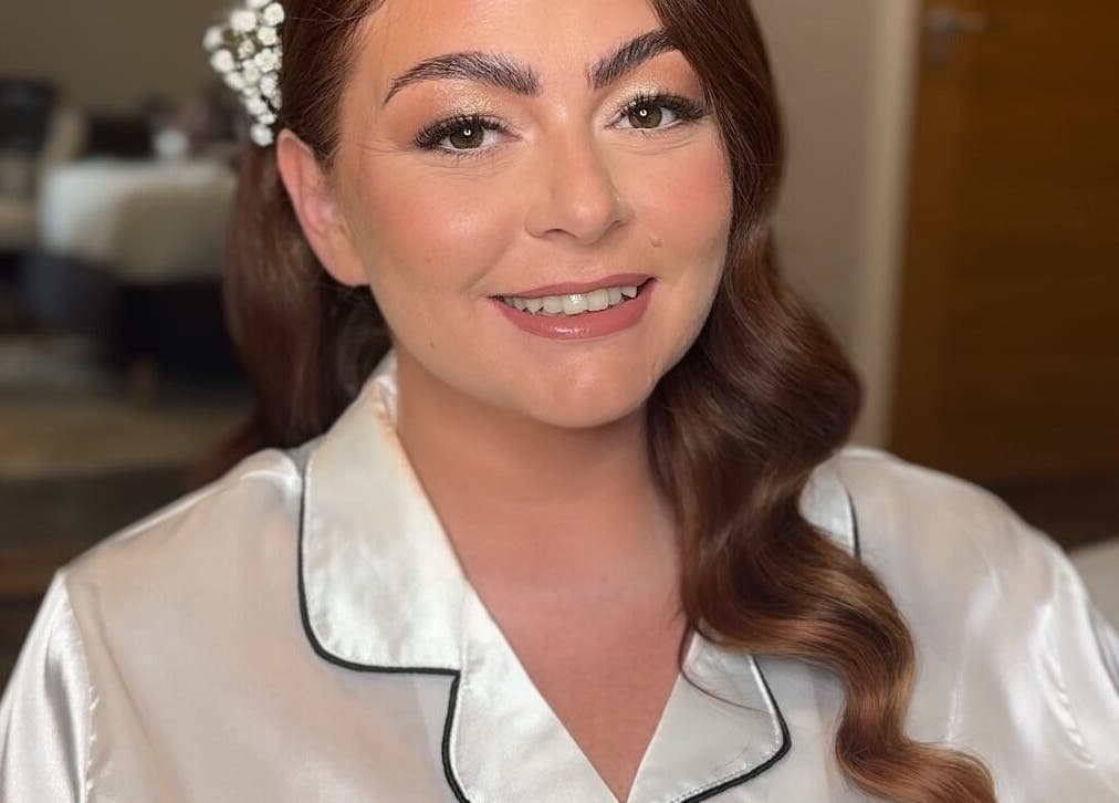 Smiling woman with bridal makeup at Made Up Salon, Rochester, England, GB, showcasing elegant styling.