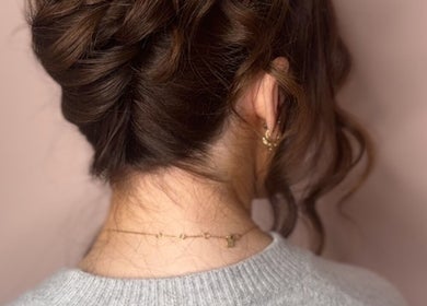 Elegant updo hairstyle at Made Up Salon, Rochester, England, GB. Ideal for special occasions.