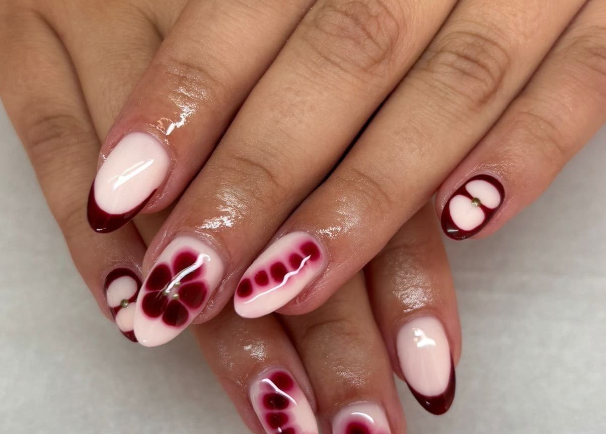 Beautiful nail art with floral designs at Made Up Salon, Rochester, England, GB.