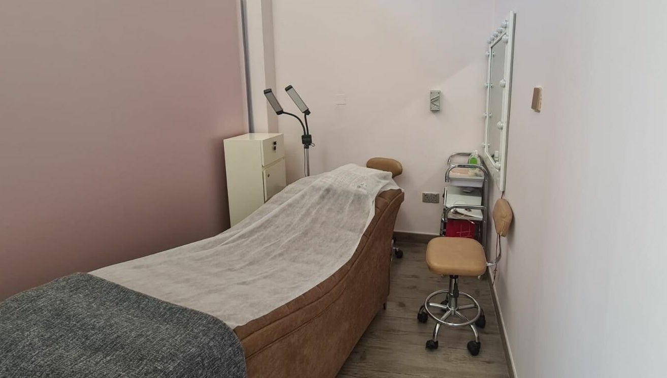 Serene treatment room at Konjo Ladies Salon, Dubai, AE, with a comfortable bed and equipment for a relaxing experience.