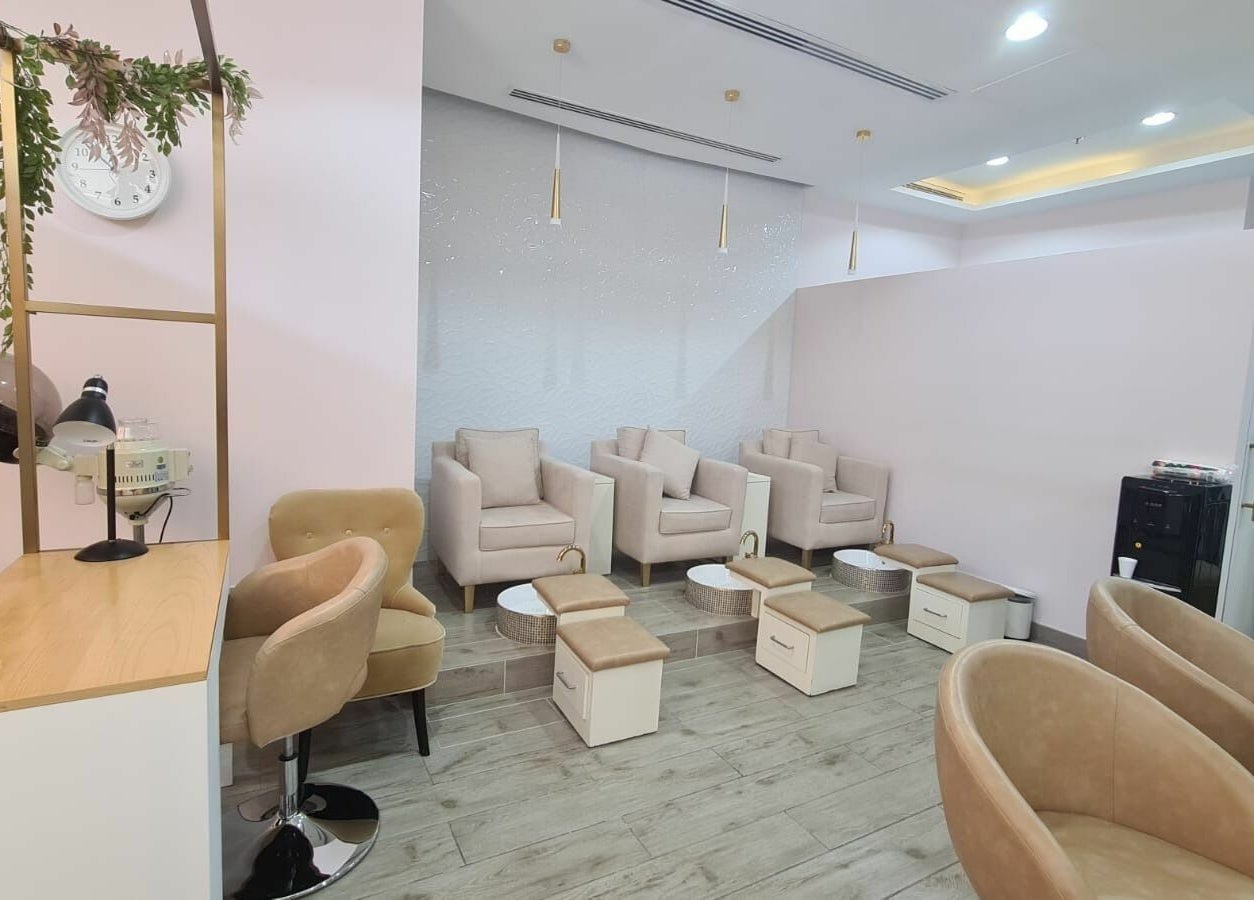 Chic pedicure area at Konjo Ladies Salon, Dubai, AE with plush seating and modern decor.
