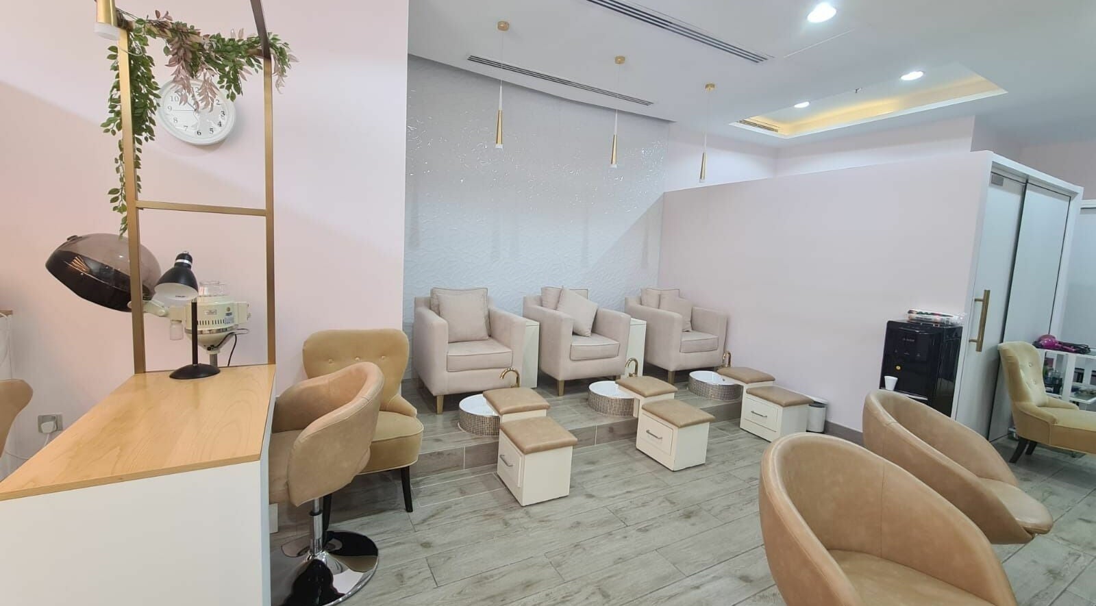 Chic pedicure area at Konjo Ladies Salon, Dubai, AE with plush seating and modern decor.