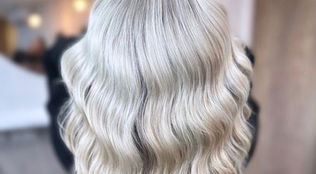 Beautiful silver wavy hair styled at J Fernandez Hair, Melbourne, Victoria, AU. Perfect for a chic, modern look.