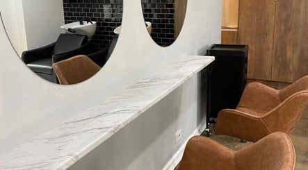 Modern salon seating and mirrors at J Fernandez Hair, Melbourne, Victoria, AU.