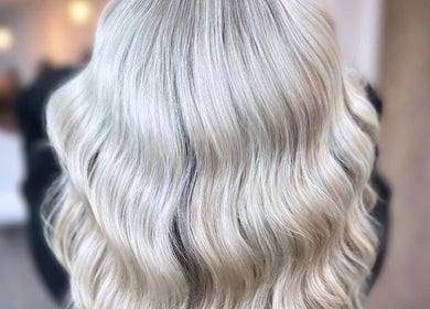 Silky platinum blonde waves at J Fernandez Hair, Melbourne, Victoria, AU. Expert hairstyling for radiant shine.