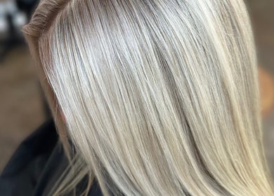 Sleek platinum blonde hairstyle at J Fernandez Hair, Melbourne, Victoria, AU.