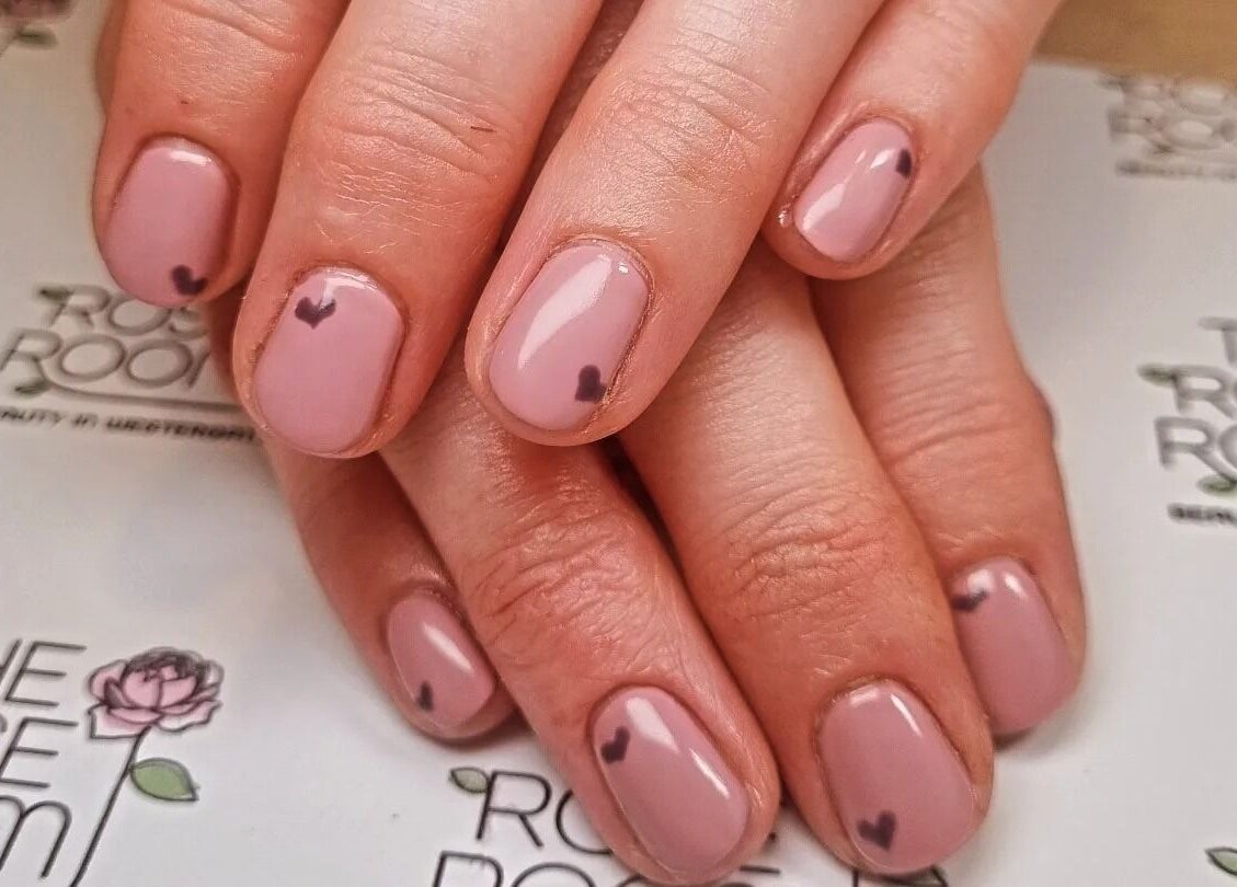 Elegant pink and heart nail art at The Rose Room, Westergate, England, GB. Perfect for beauty enthusiasts.