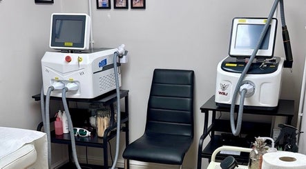 Interior of ER Laser Clinic & Piercing, featuring advanced laser machines, Wisbech, England, GB.