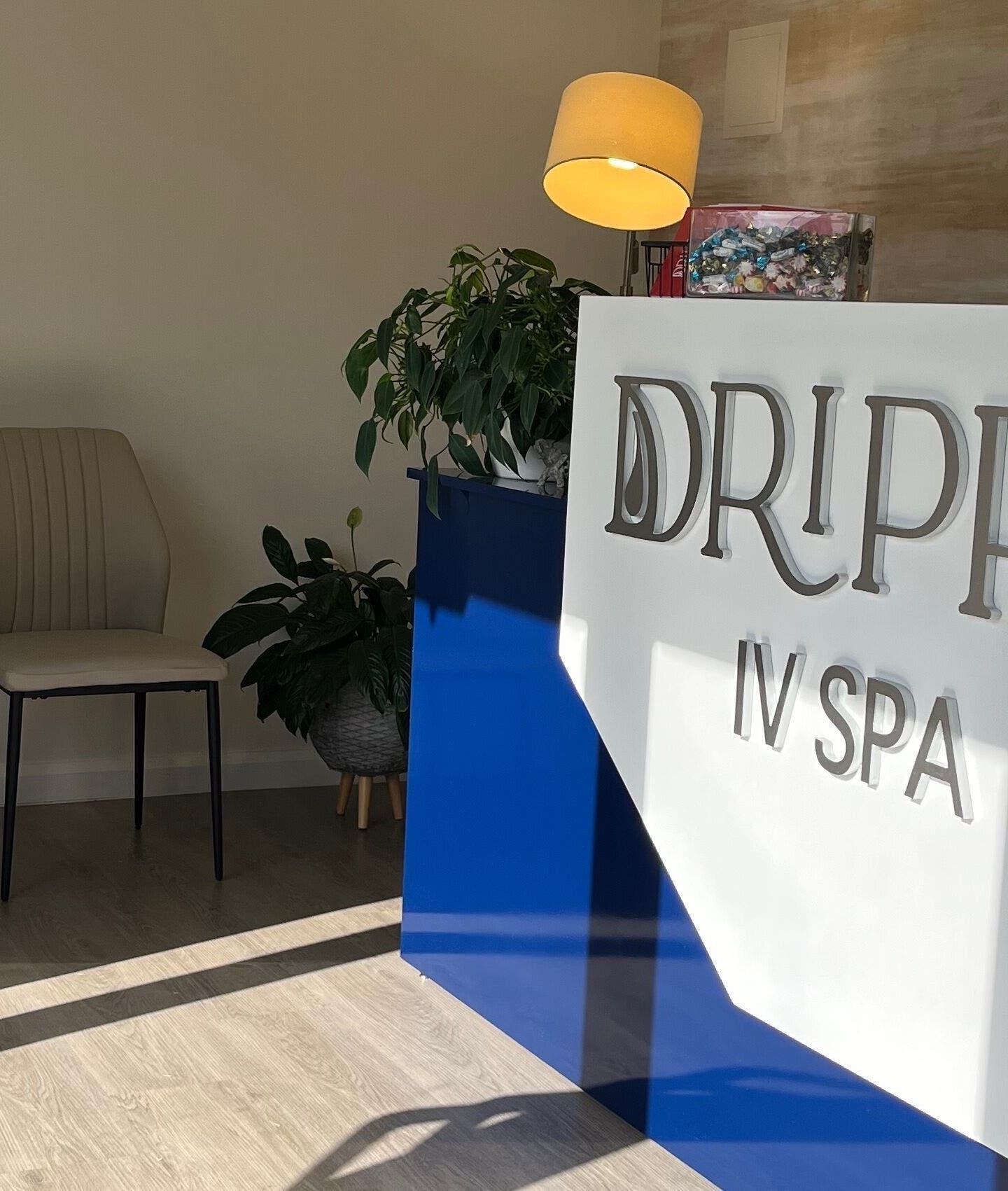 Drippy IV Spa's welcoming reception area in Westmoorings, TT with chic decor and seating.
