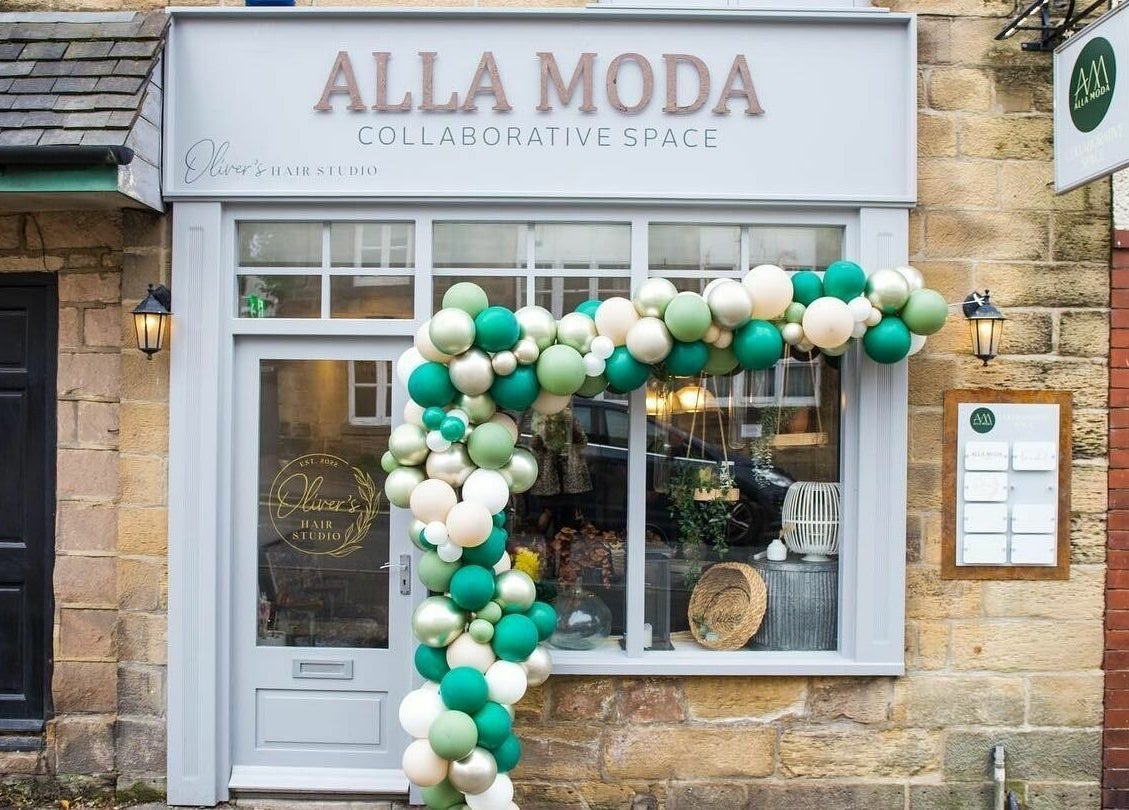 Charming exterior of Oliver's Hair Studio Limited in Belper, England, GB, adorned with festive balloons.