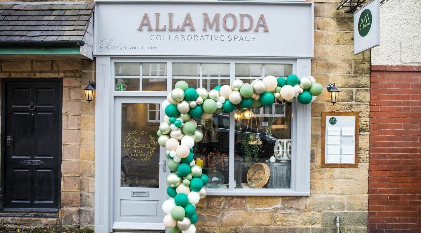 Charming exterior of Oliver's Hair Studio Limited in Belper, England, GB, adorned with festive balloons.