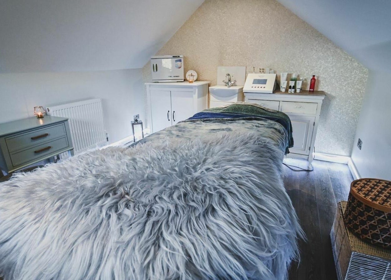 Luxurious spa room at Oliver's Hair Studio Limited in Belper, England, GB featuring a fur-clad massage table.