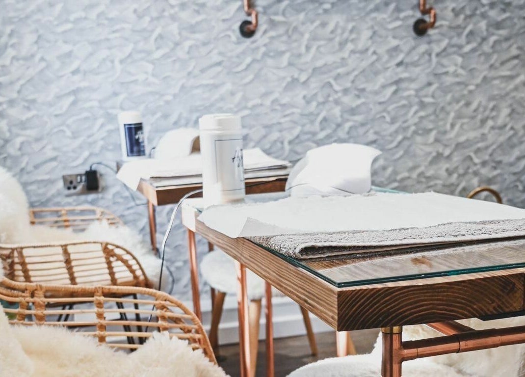 Elegant manicure tables at Oliver's Hair Studio Limited, Belper, England, GB, showcase modern comfort.