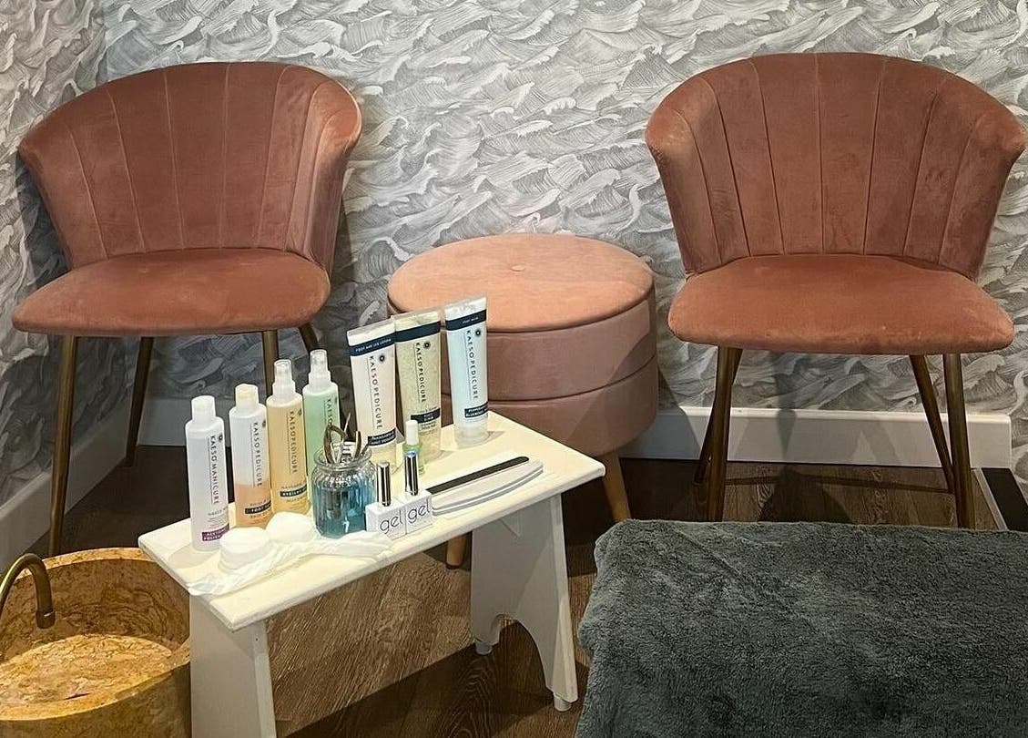 Elegant seating area at Oliver's Hair Studio Limited in Belper, England, GB with beauty products displayed.