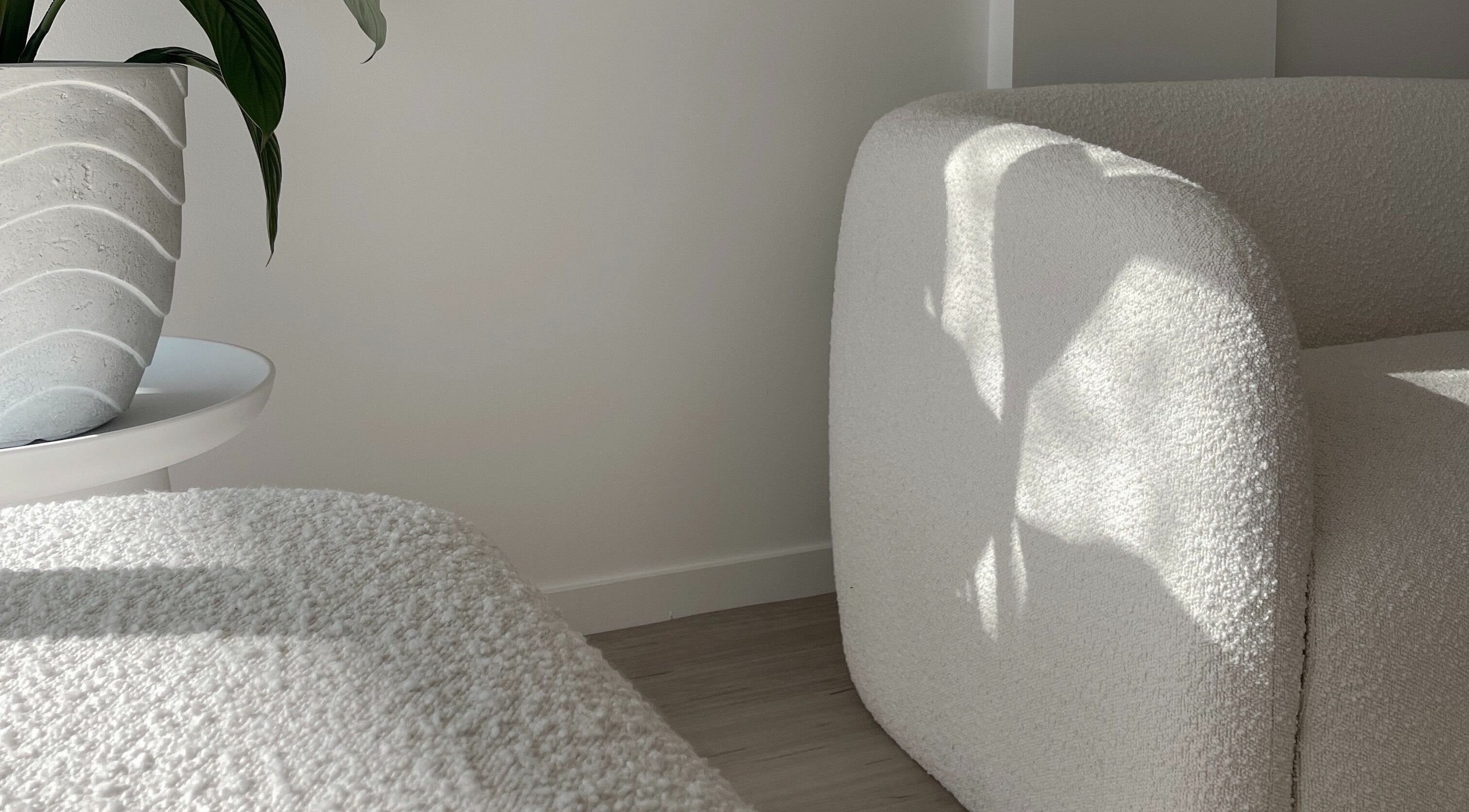 Modern waiting area at Imani Skin Clinic, Maroochydore, Queensland, AU, featuring cozy chairs and elegant decor.