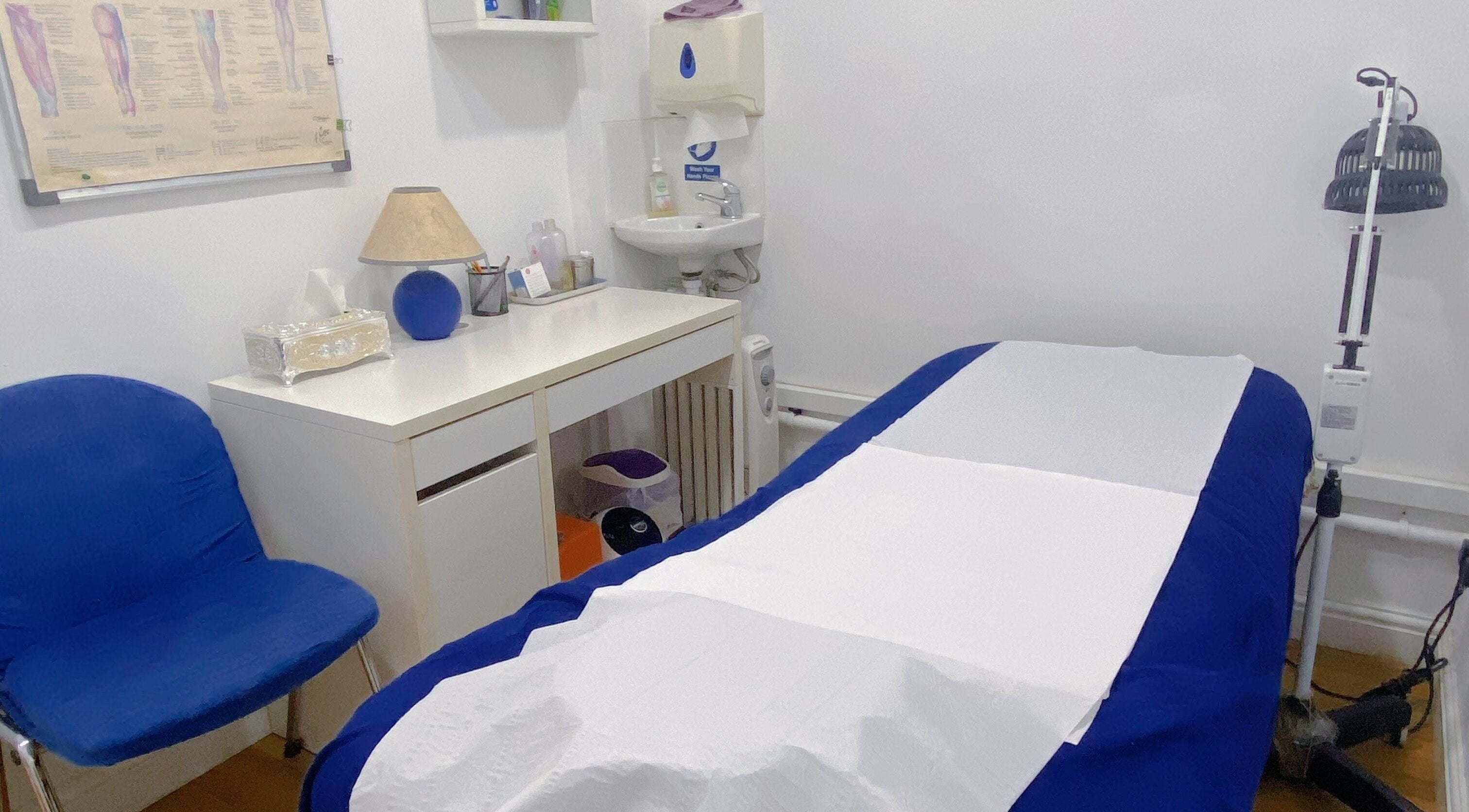Tranquil therapy room at Heloca Therapies & Beauty Expert in Birmingham, England, GB, with a prepared treatment bed.