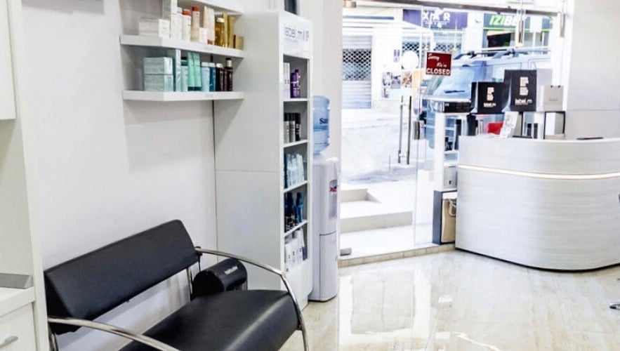Modern interior of TONI&GUY Ibrag in Is-swieqi, MT with sleek seating and product displays.