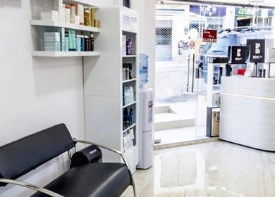 Modern interior of TONI&GUY Ibrag in Is-swieqi, MT with sleek seating and product displays.