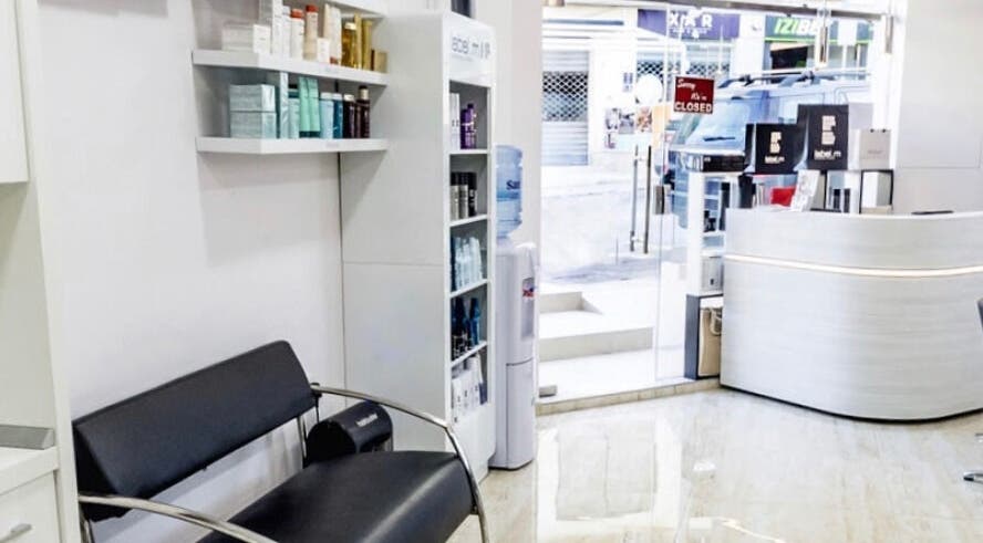 Modern interior of TONI&GUY Ibrag in Is-swieqi, MT with sleek seating and product displays.