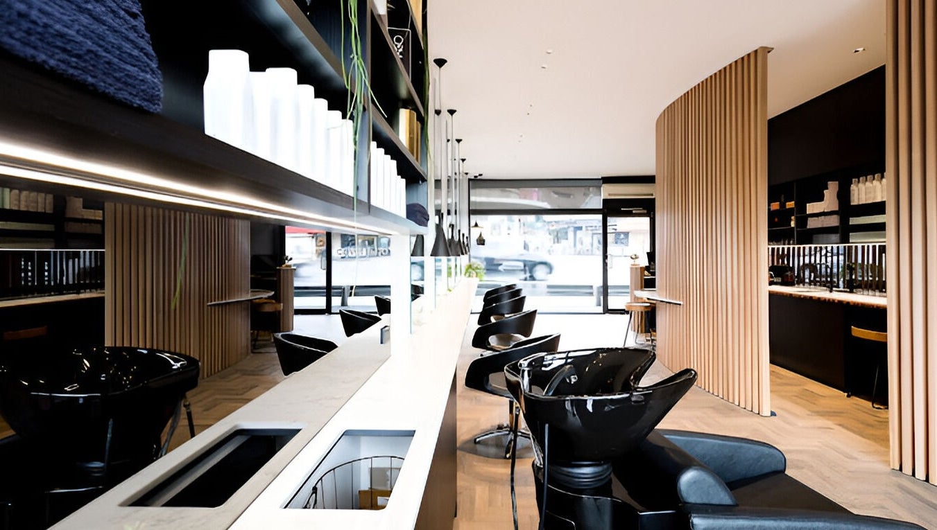 Modern interior at Covet & Co, Melbourne, Victoria, AU featuring sleek salon stations and stylish decor.