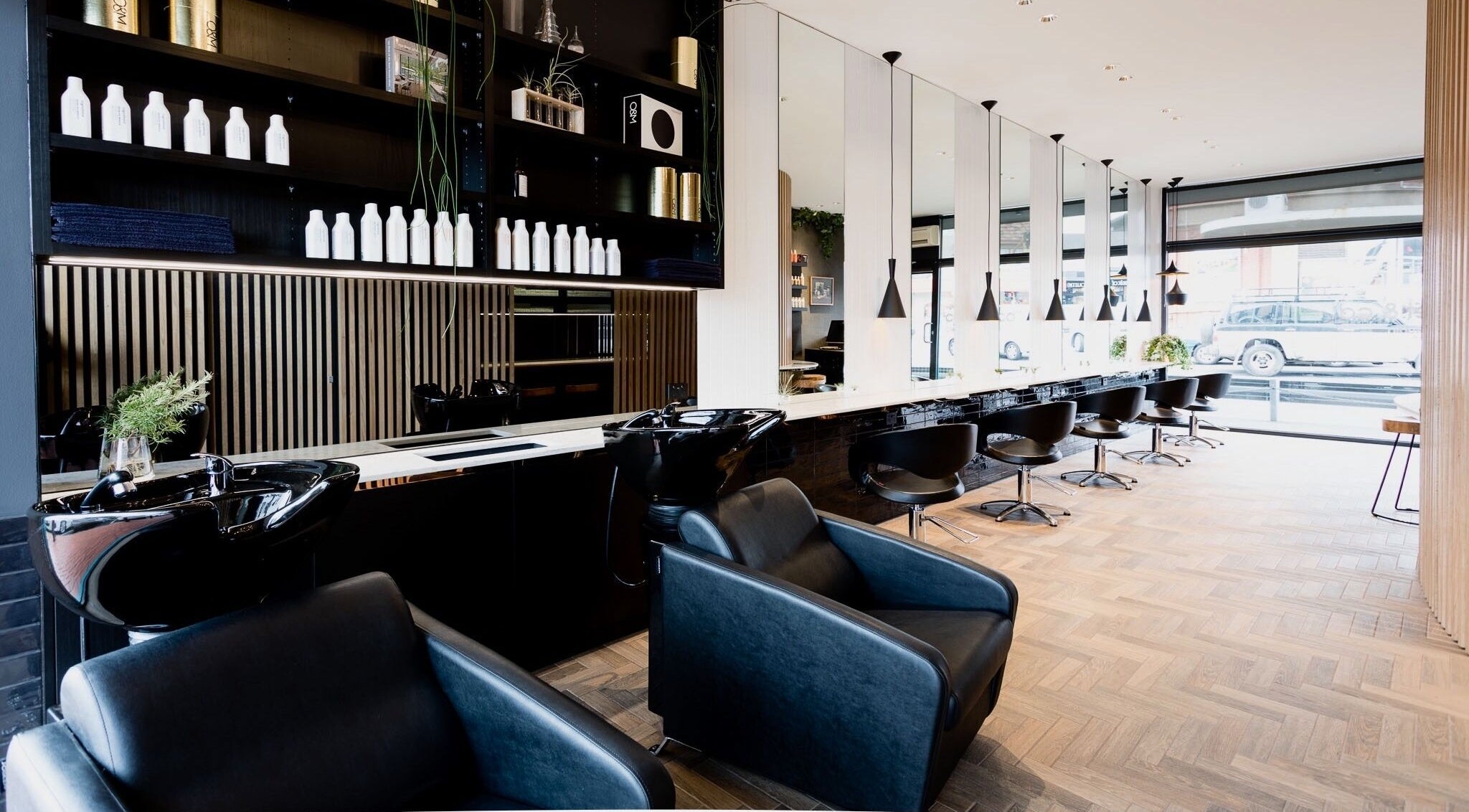 Modern salon interior at Covet & Co, Melbourne, Victoria, AU with sleek chairs and stylish decor.