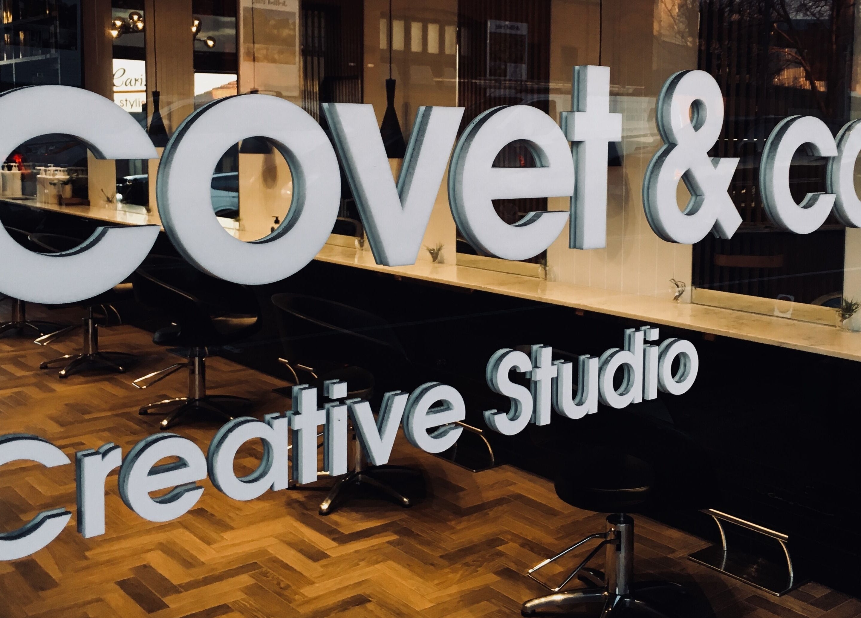 Covet & Co salon entrance in Melbourne, Victoria, AU featuring stylish interior with creative studio branding.