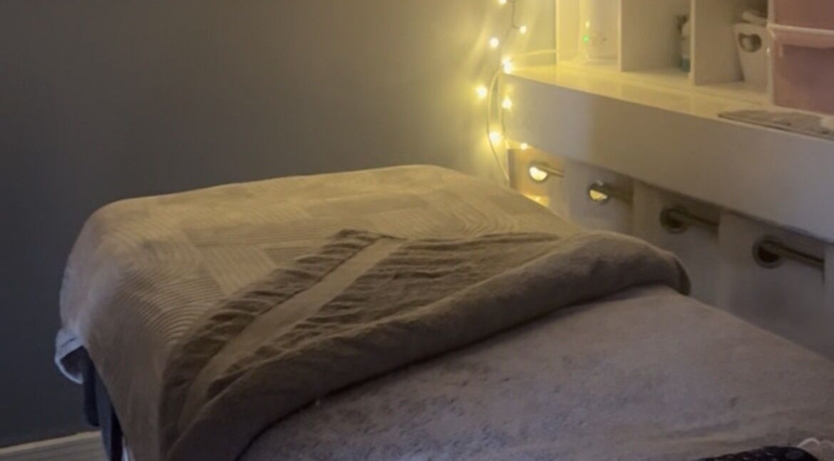 Cozy massage table with warm lighting at Secret Garden Spa, Gartcosh, Scotland, GB.