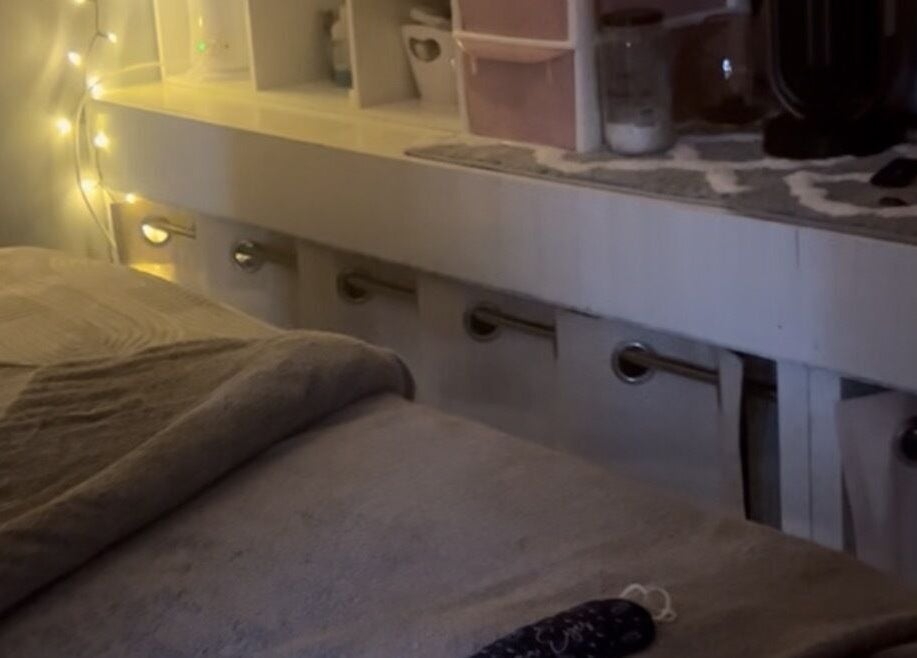 Serene massage table in Secret Garden Spa, Gartcosh, Scotland, GB showcases ambient lighting.