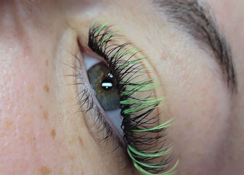 Close-up of eye with green-tinted lashes at DS BEAUTY, Dundee, Scotland, GB.