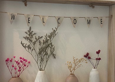 Welcome sign with dried flowers at Nicole Whitney’s Beauty & Spa treatments, Sileby, England, GB.