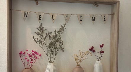 Welcome sign with dried flowers at Nicole Whitney’s Beauty & Spa treatments, Sileby, England, GB.