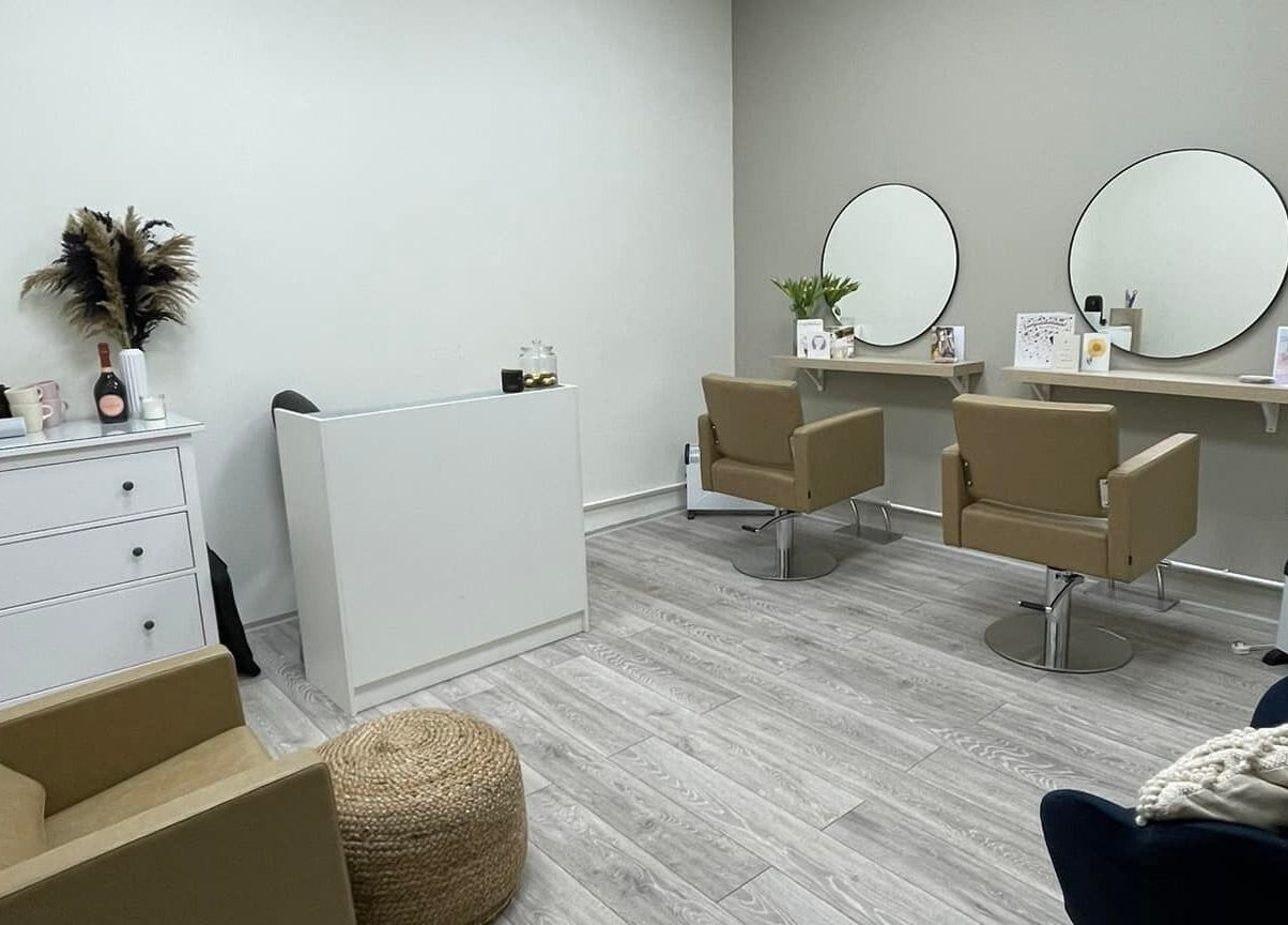 Modern salon chairs and mirrors at 11:11 Hairdressing, Wrexham, Wales, GB, showcasing a stylish beauty space.